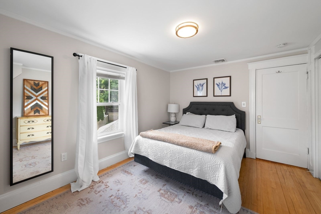 1111 Brook Road Milton, MA 02186 - Photo 10 of 22 a bedroom with a bed and a window