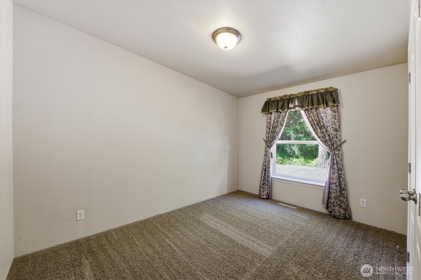 1142 Driskill Road Newport, WA 99156 - Photo 18 of 40 a view of an empty room with a window