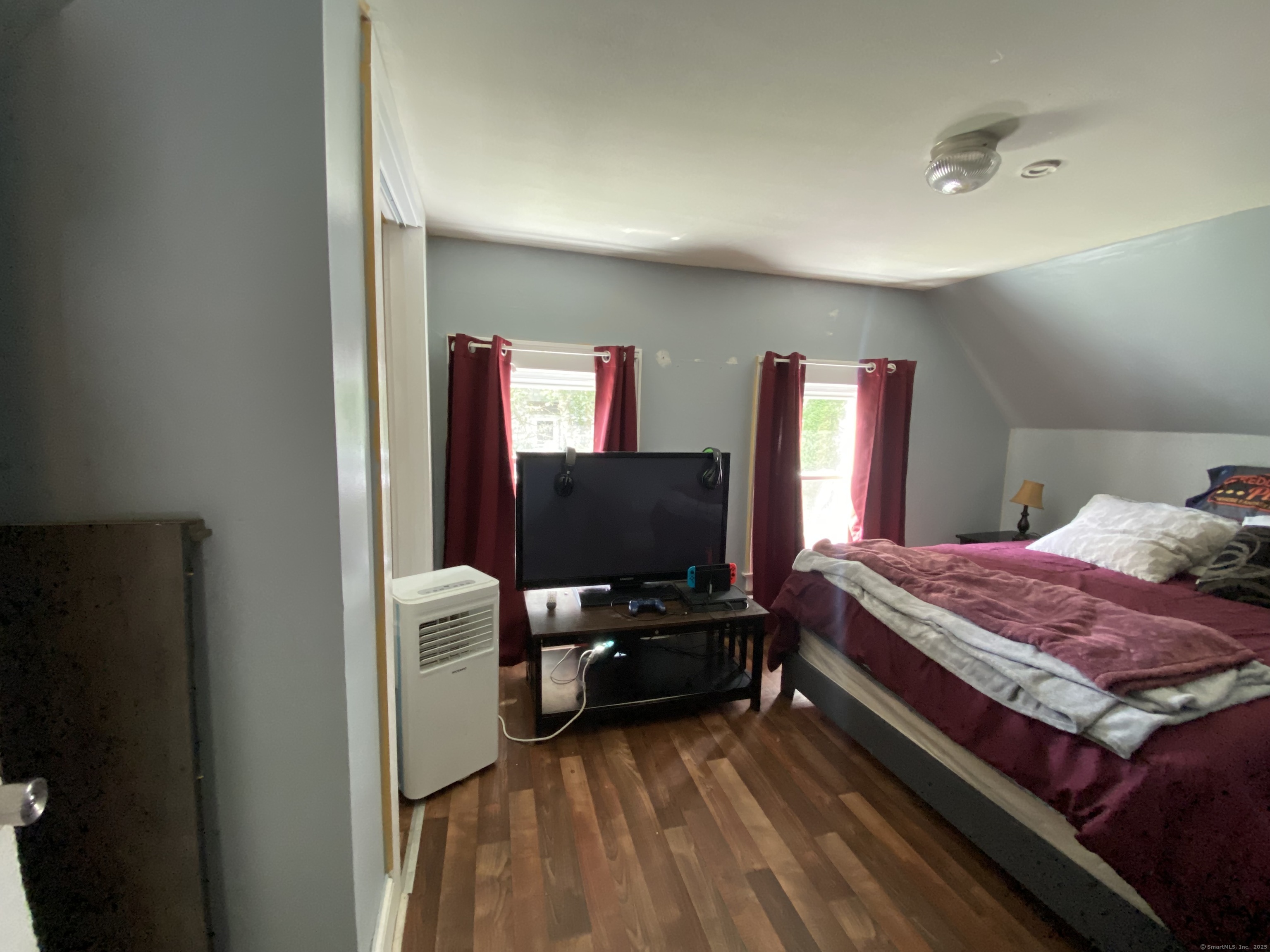 148 Hillside Avenue Torrington, CT 06790 - Photo 17 of 38 a bedroom with a bed and flat screen tv