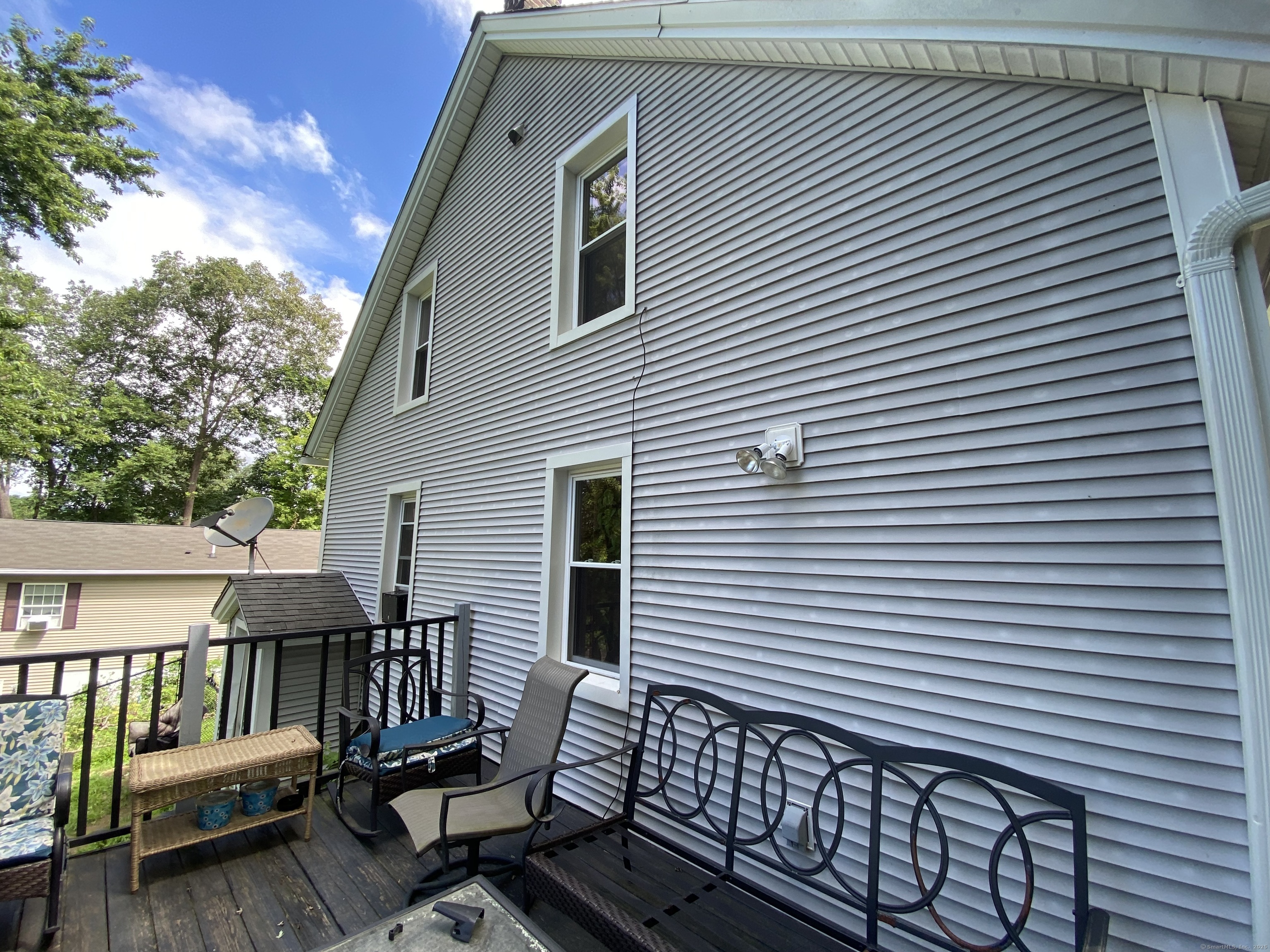 148 Hillside Avenue Torrington, CT 06790 - Photo 32 of 38 a view of a roof deck with wooden floor and fence
