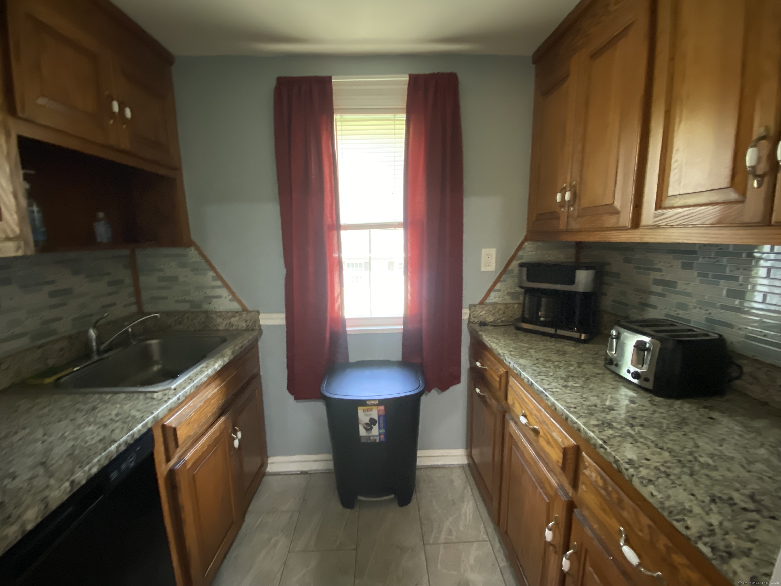 148 Hillside Avenue Torrington, CT 06790 - Photo 8 of 38 a kitchen with stainless steel appliances granite countertop sink stove and cabinets