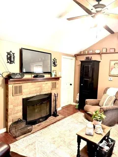 a living room with furniture and a window