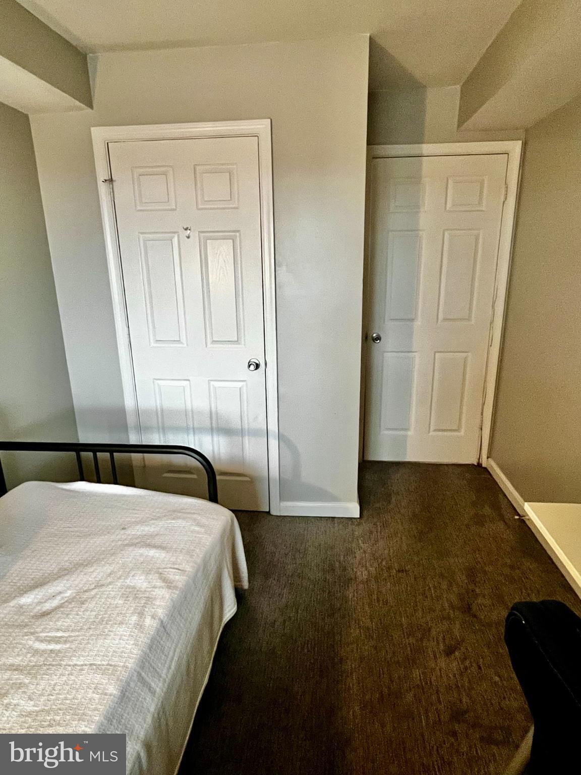 2609 Douglass Road Southeast, Unit 402 Washington, DC 20020 - Photo 21 of 35 a bedroom with a bed and a window