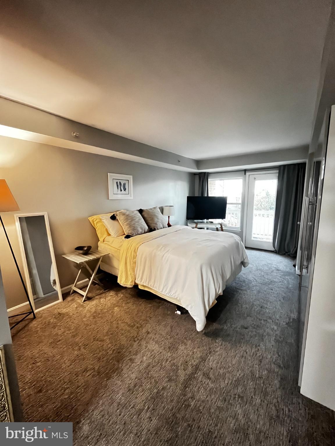 2609 Douglass Road Southeast, Unit 402 Washington, DC 20020 - Photo 26 of 35 a bedroom with double bed and a window