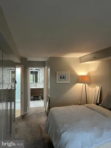 a bedroom with a large bed and a closet