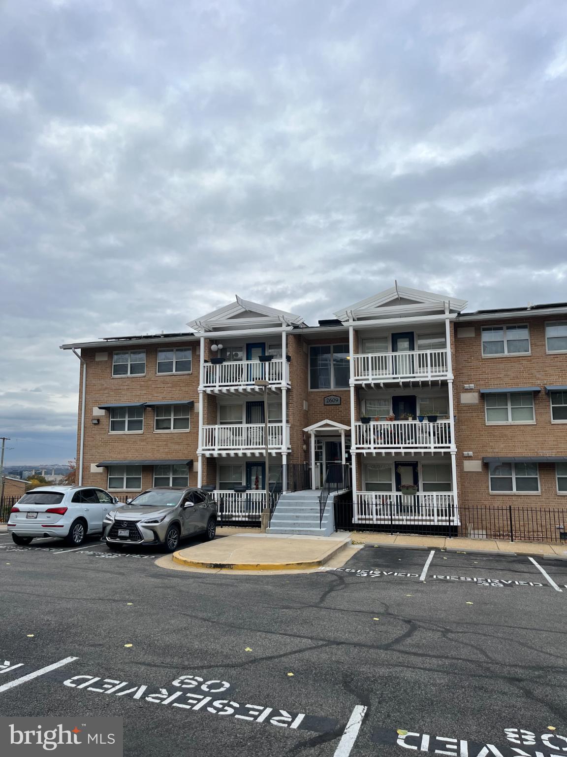 2609 Douglass Road Southeast, Unit 402 Washington, DC 20020 - Photo 33 of 35 a car parked in front of a building