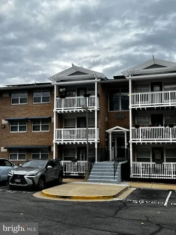 a view of a brick house with many windows