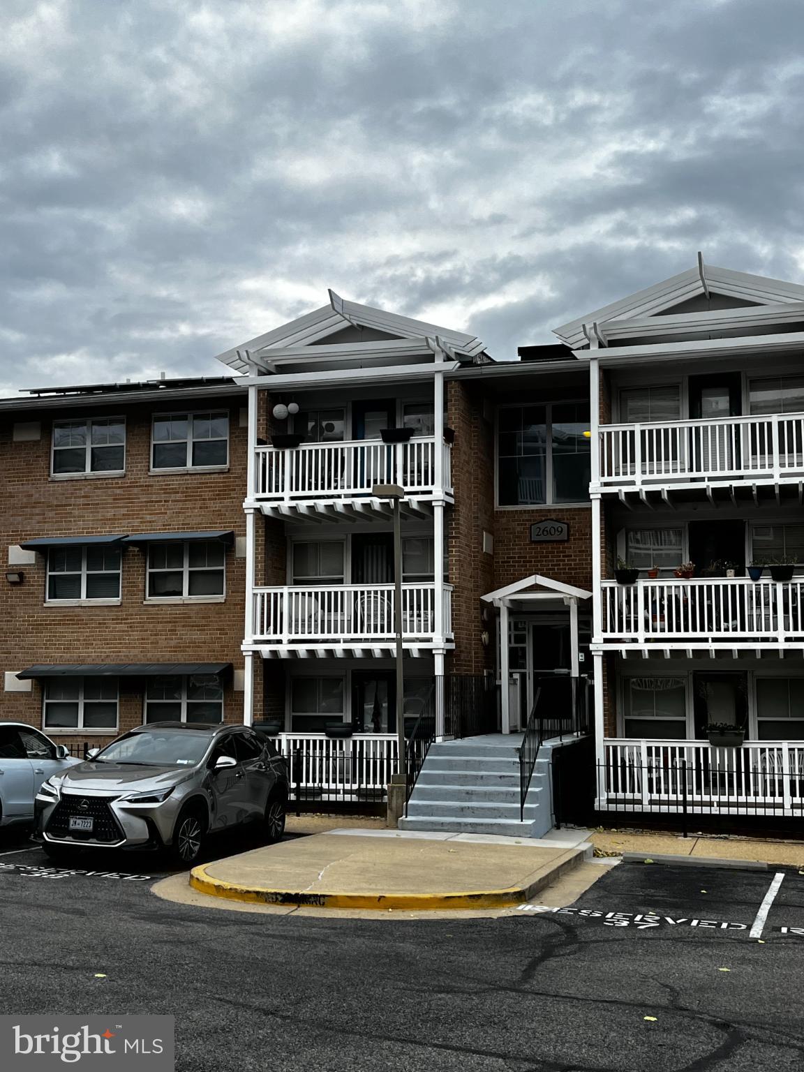 2609 Douglass Road Southeast, Unit 402 Washington, DC 20020 - Photo 34 of 35 a view of a brick house with many windows