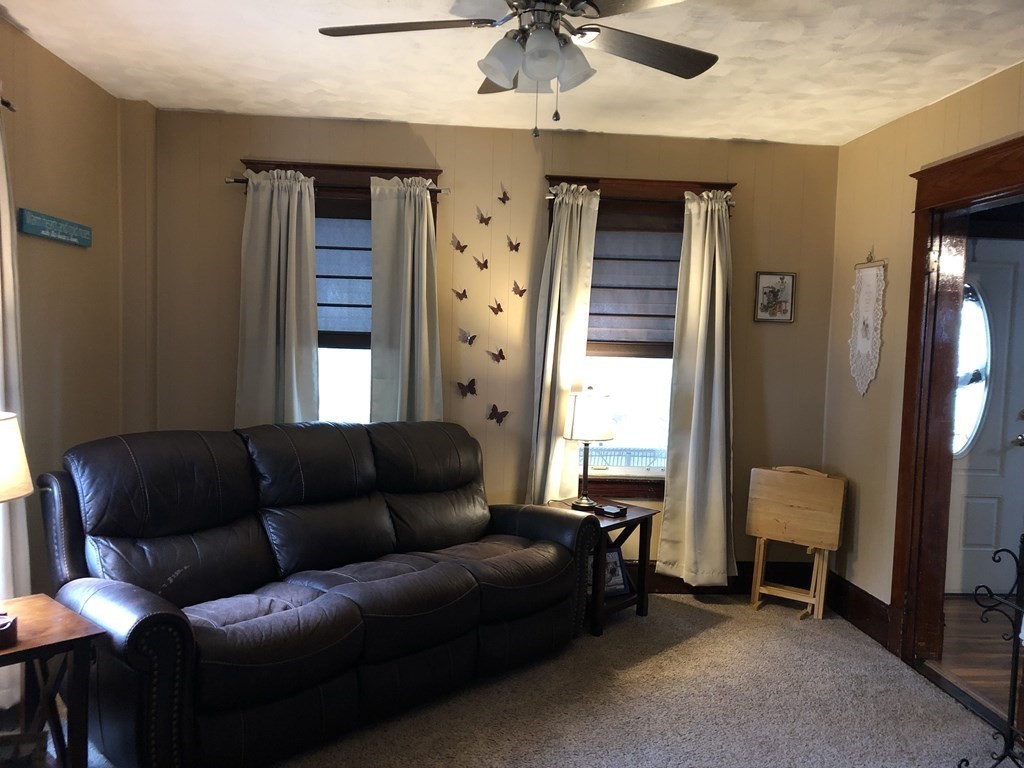 23 Acton Street Springfield, MA 01151 - Photo 11 of 33 a living room with furniture and a window