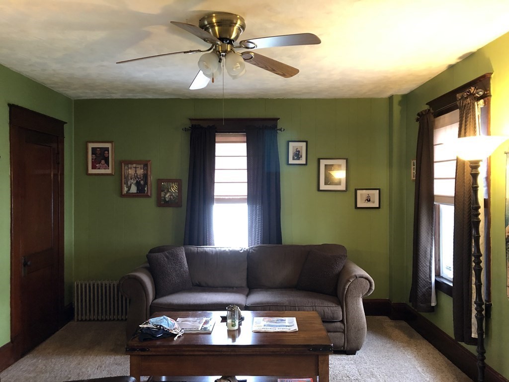 23 Acton Street Springfield, MA 01151 - Photo 12 of 33 a living room with furniture and a window