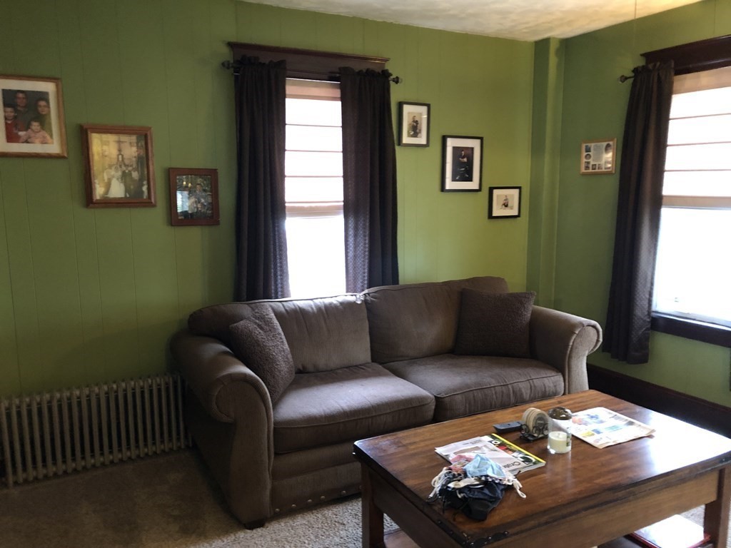 23 Acton Street Springfield, MA 01151 - Photo 13 of 33 a living room with furniture and a window