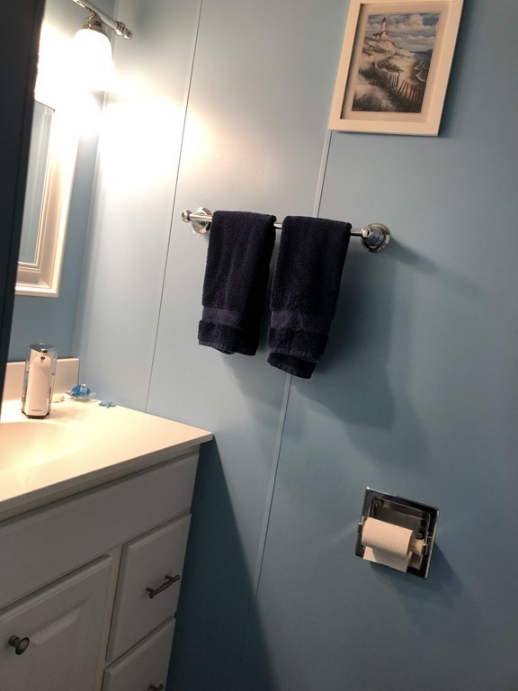 23 Acton Street Springfield, MA 01151 - Photo 14 of 33 a bathroom with a sink and a mirror
