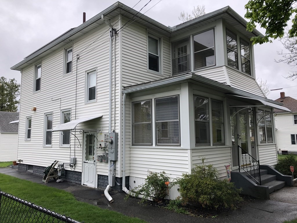 23 Acton Street Springfield, MA 01151 - Photo 2 of 33 a view of a house with a yard