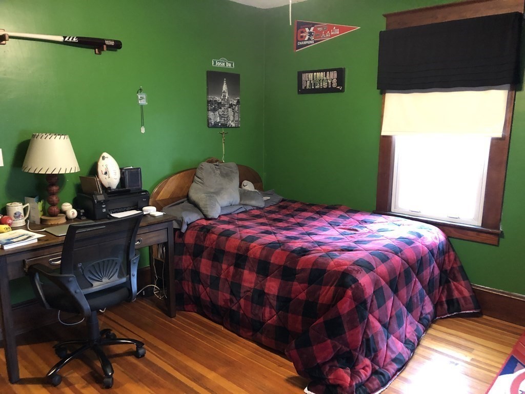 23 Acton Street Springfield, MA 01151 - Photo 21 of 33 a bedroom with a bed and a window