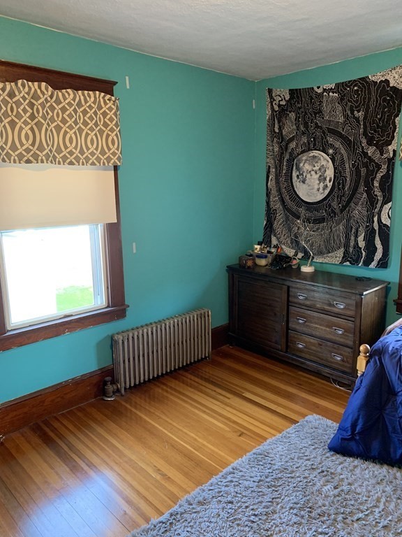 23 Acton Street Springfield, MA 01151 - Photo 24 of 33 a view of a room with toys and wooden floor