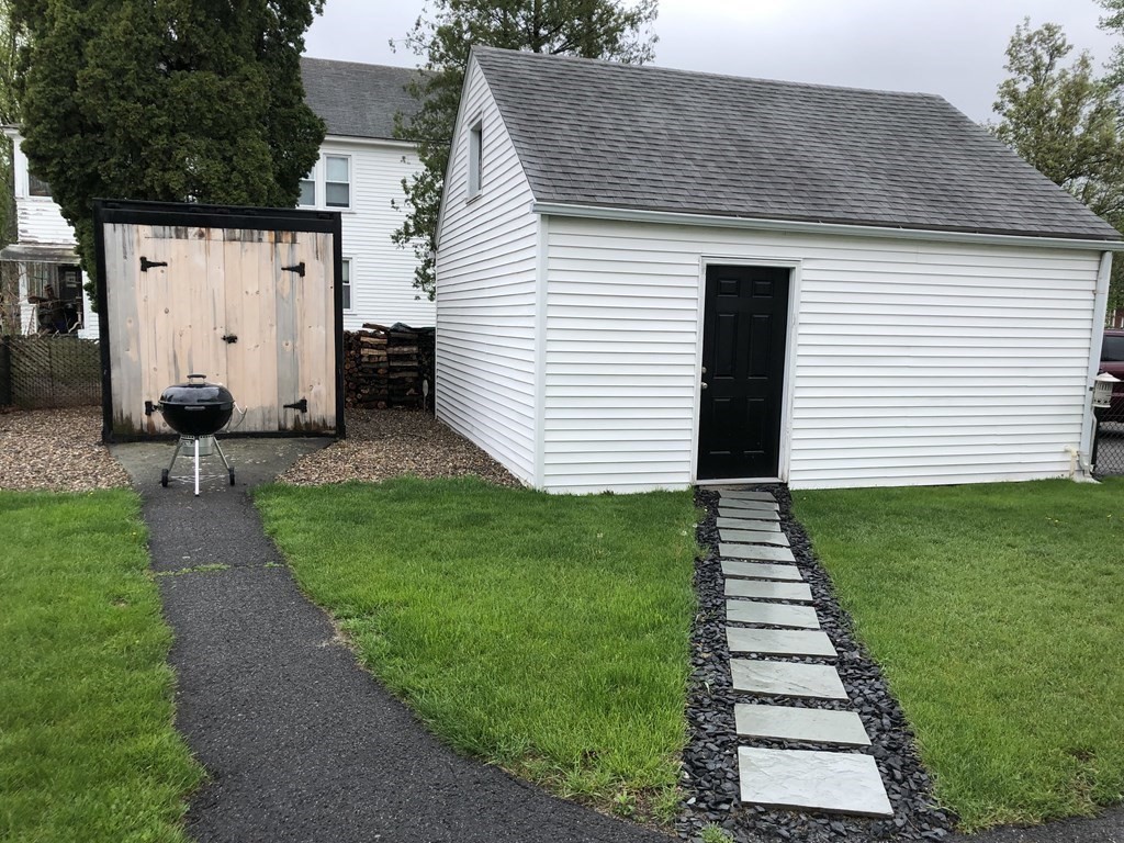 23 Acton Street Springfield, MA 01151 - Photo 31 of 33 a front view of a house with a yard