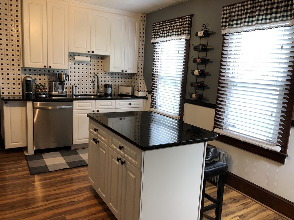 23 Acton Street Springfield, MA 01151 - Photo 4 of 33 a kitchen with granite countertop a sink and a stove