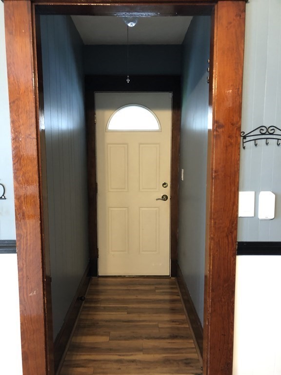 23 Acton Street Springfield, MA 01151 - Photo 9 of 33 a view of a hallway with wooden floor