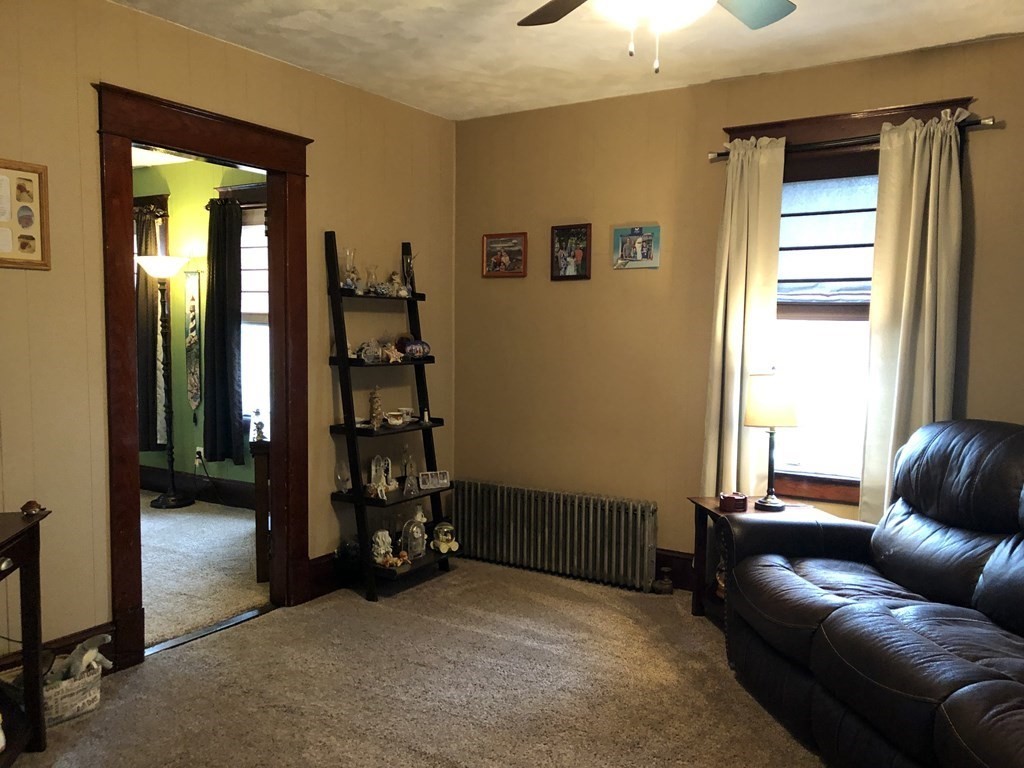 23 Acton Street Springfield, MA 01151 - Photo 10 of 33 a livingroom with window and furniture