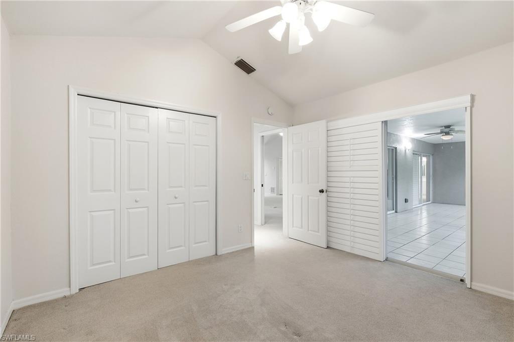 203 Via Perignon, Unit 24 Naples, FL 34119 - Photo 26 of 42 Guest bedroom offers a pocket door to create a lovely guest suite which leads to Lanai