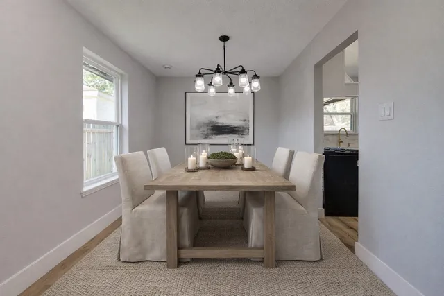 a kitchen with granite countertop a stove top oven and cabinets