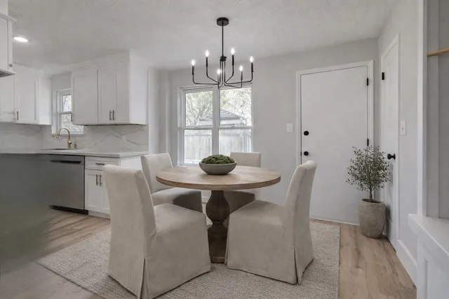 a living room with furniture a table and a fireplace