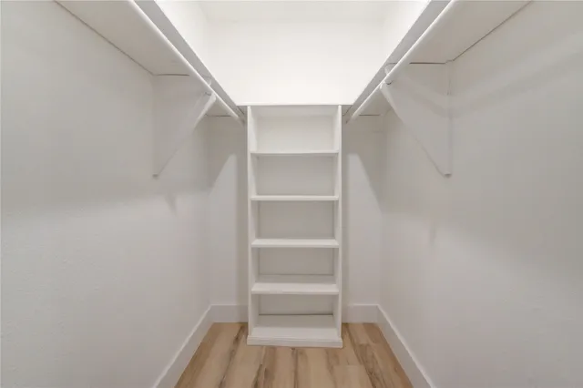 a view of backyard with swimming pool and seating