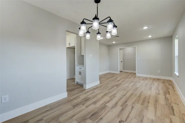 a kitchen with stainless steel appliances granite countertop a stove and a sink