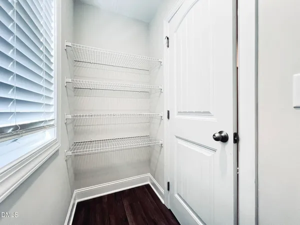 a view of a room with racks on the wall