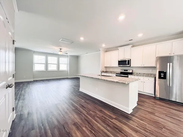a view of kitchen and wooden floor