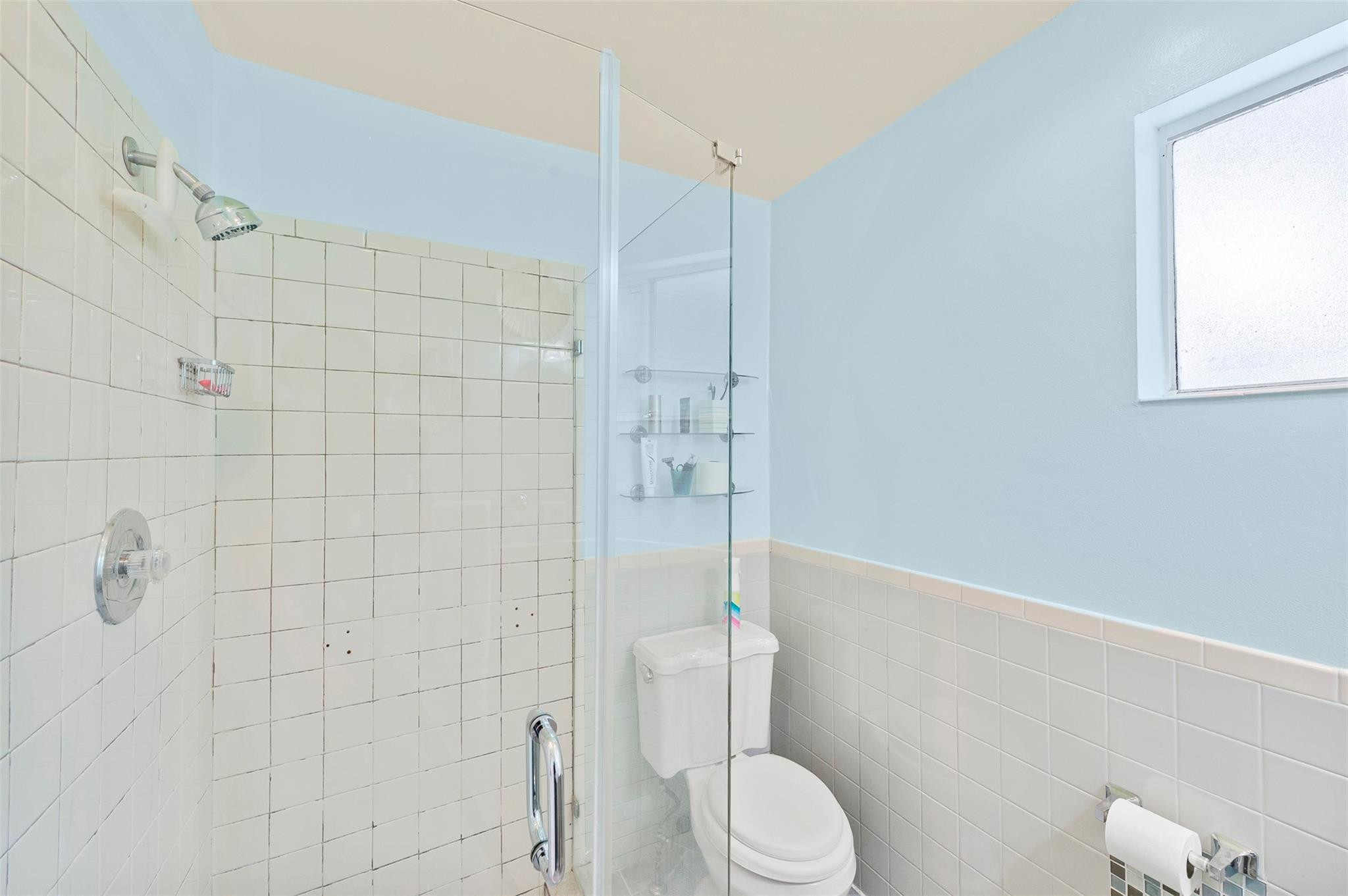 946 Alamanda Road West Palm Beach, FL 33405 - Photo 12 of 56 a bathroom with a toilet and shower