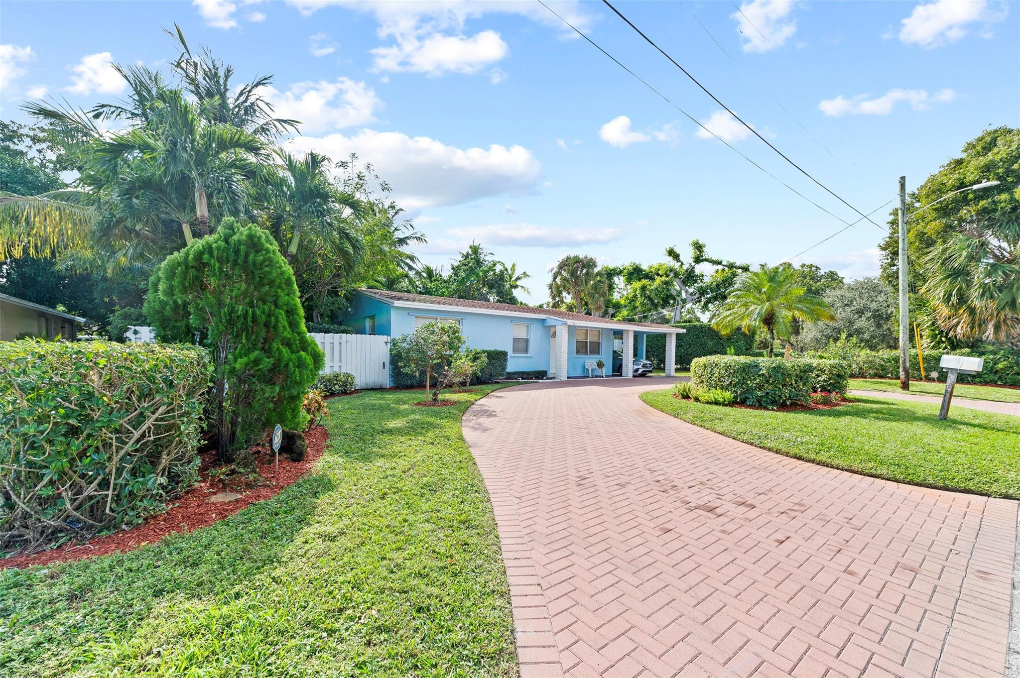946 Alamanda Road West Palm Beach, FL 33405 - Photo 17 of 56 a front view of a house with a yard