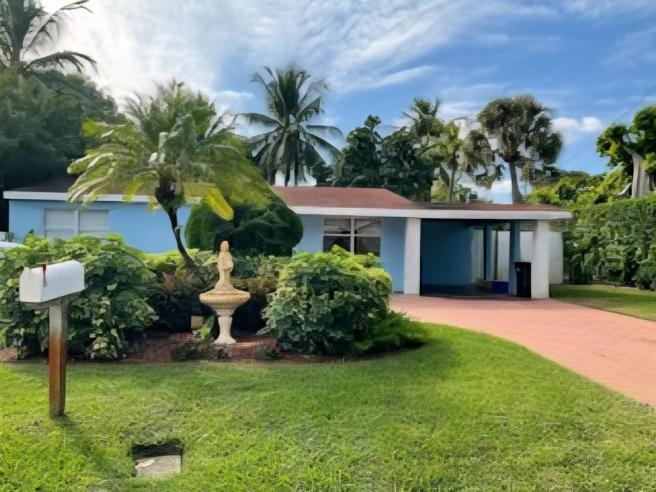 946 Alamanda Road West Palm Beach, FL 33405 - Photo 20 of 56 a front view of house with yard and green space
