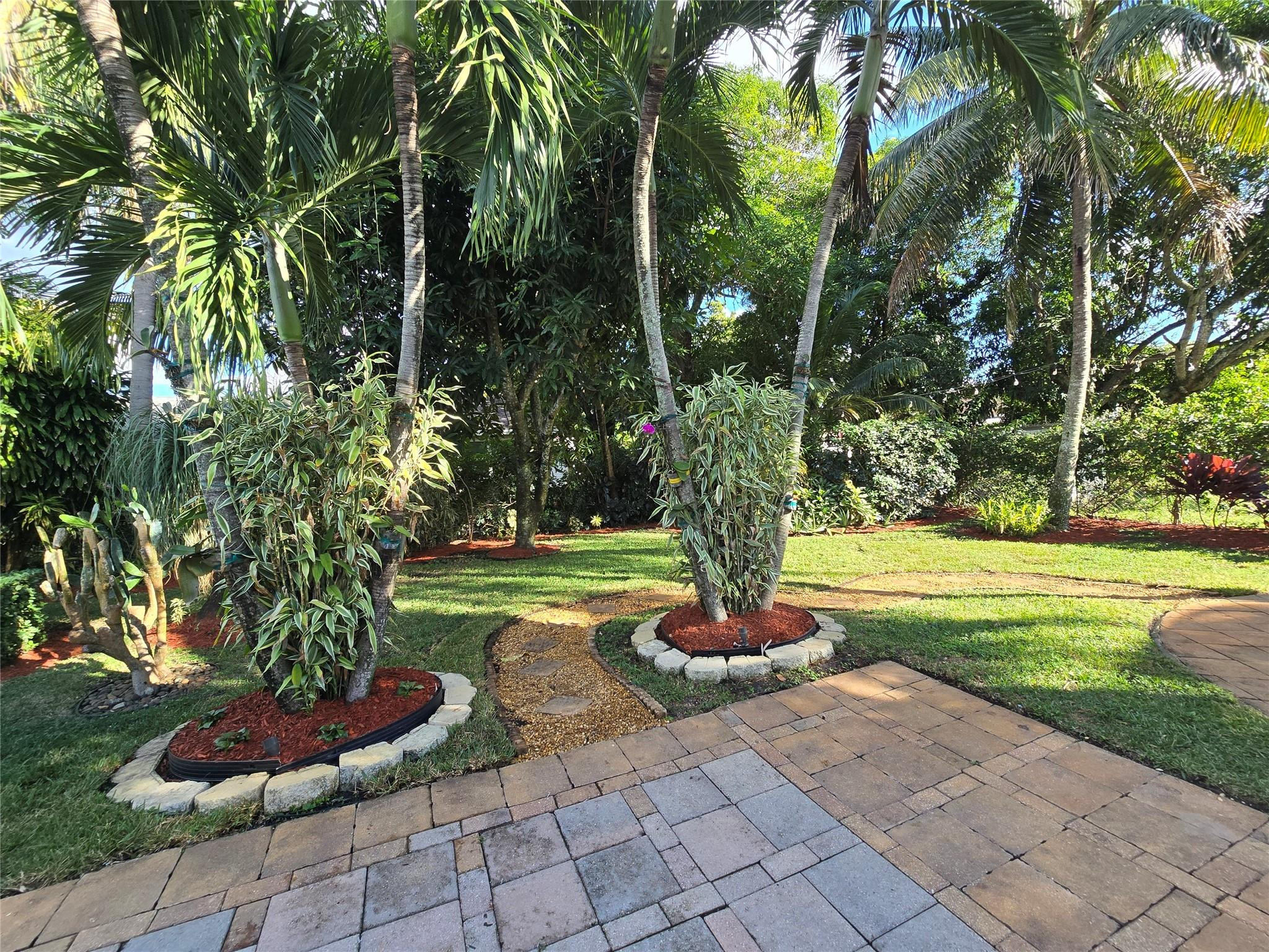 946 Alamanda Road West Palm Beach, FL 33405 - Photo 21 of 56 a park view with a fountain and large trees