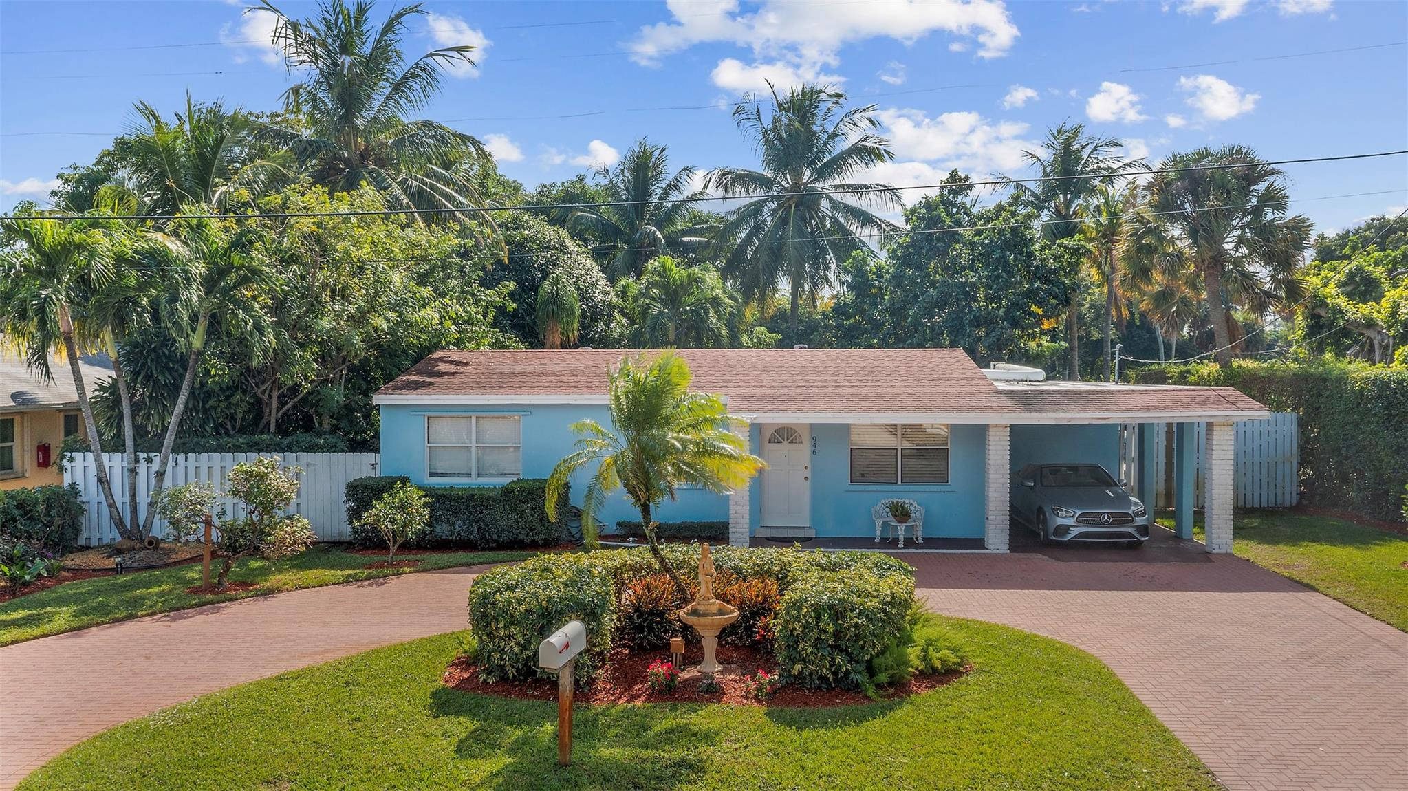 946 Alamanda Road West Palm Beach, FL 33405 - Photo 25 of 56 a front view of a house with garden