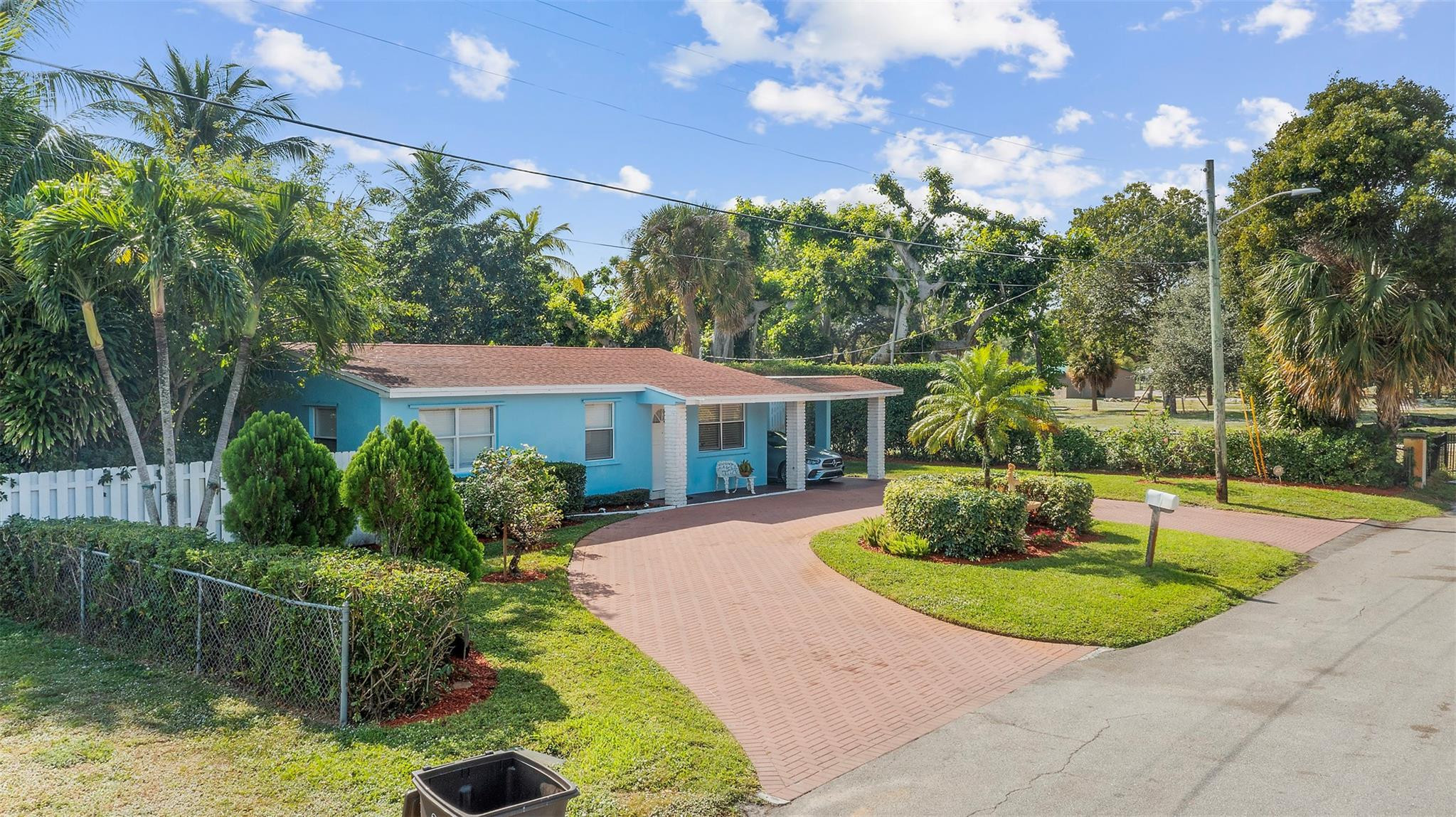 946 Alamanda Road West Palm Beach, FL 33405 - Photo 26 of 56 a front view of a house with a yard