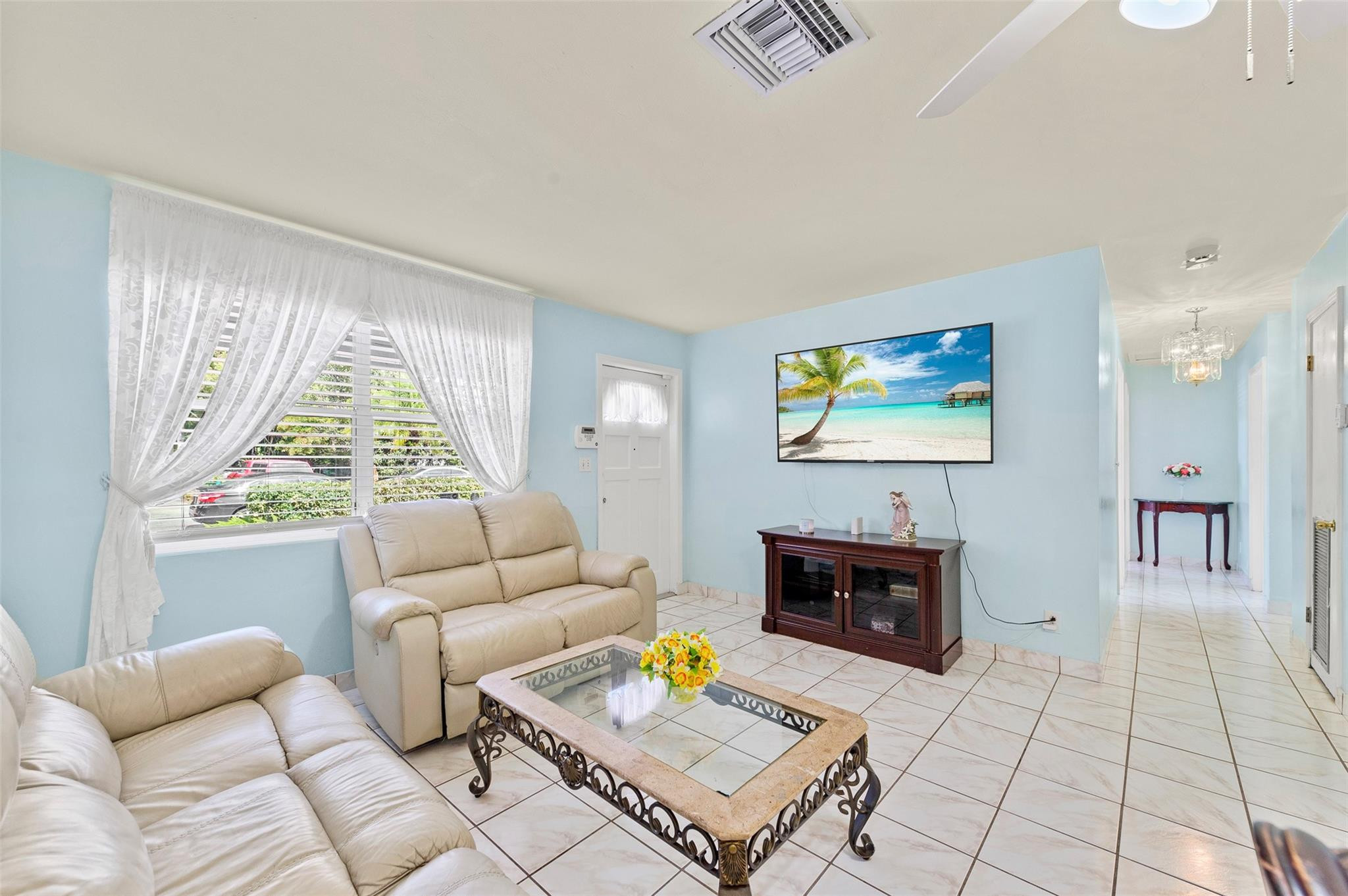 946 Alamanda Road West Palm Beach, FL 33405 - Photo 34 of 56 a living room with furniture a rug and a fireplace