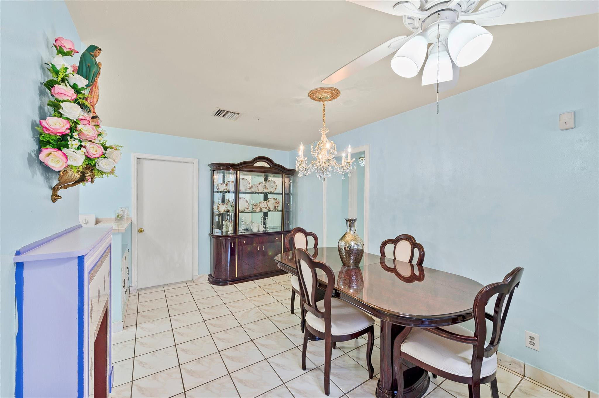946 Alamanda Road West Palm Beach, FL 33405 - Photo 35 of 56 a view of a dining room with furniture wooden floor and chandelier