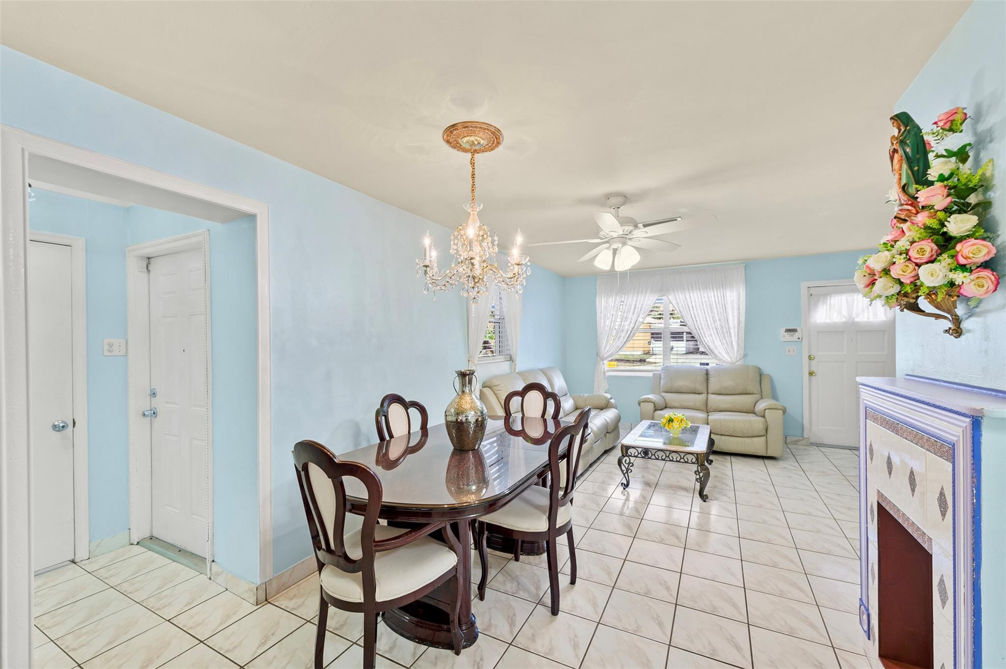 946 Alamanda Road West Palm Beach, FL 33405 - Photo 36 of 56 a view of a dining room with furniture and chandelier