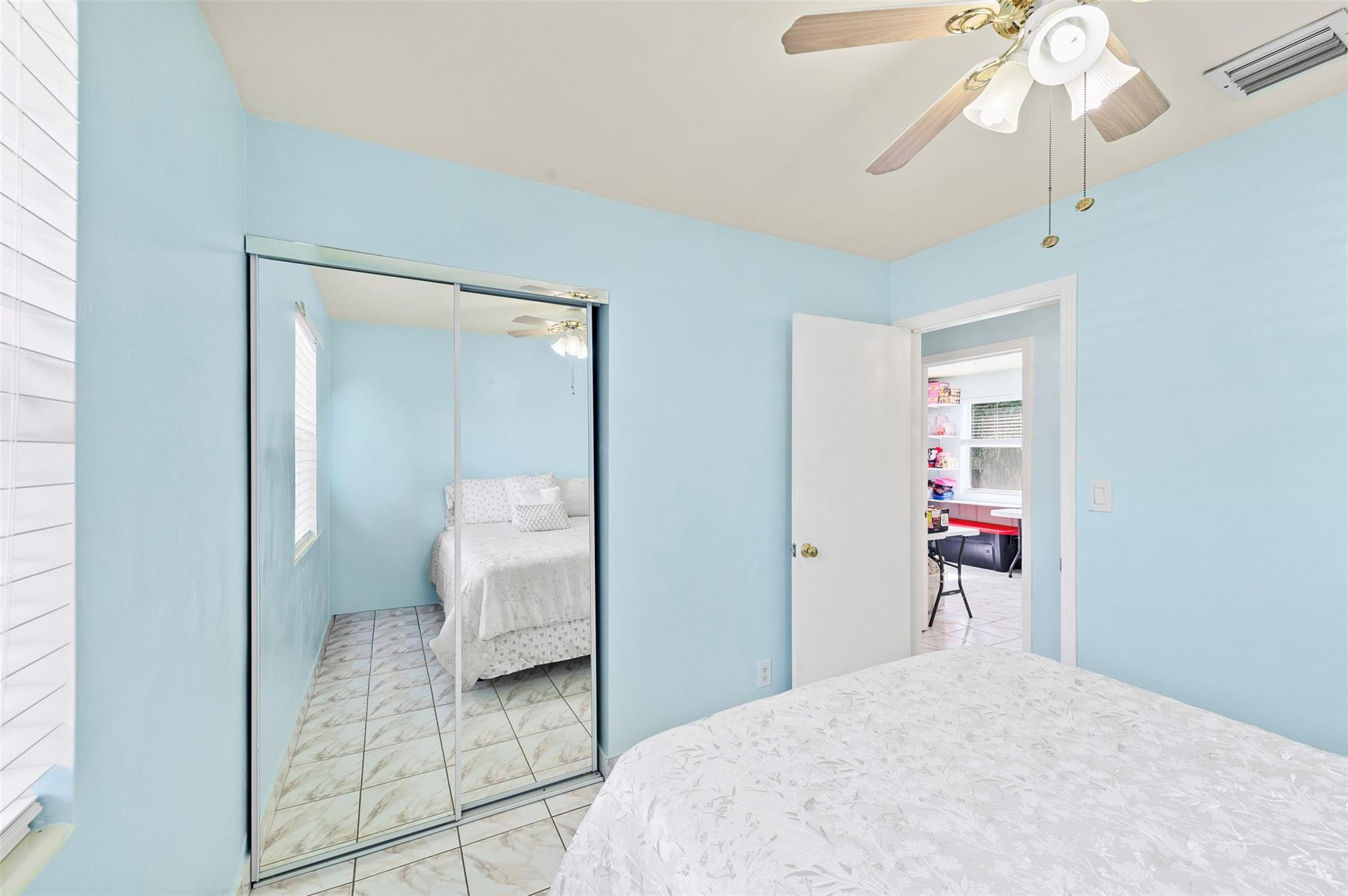946 Alamanda Road West Palm Beach, FL 33405 - Photo 46 of 56 a bedroom with a bed and a mirror