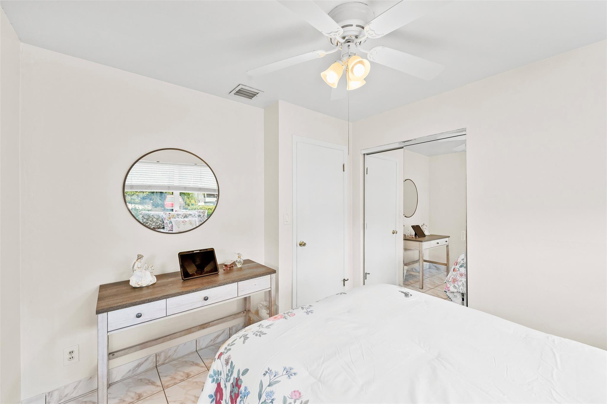 946 Alamanda Road West Palm Beach, FL 33405 - Photo 50 of 56 a bedroom with bed and a table
