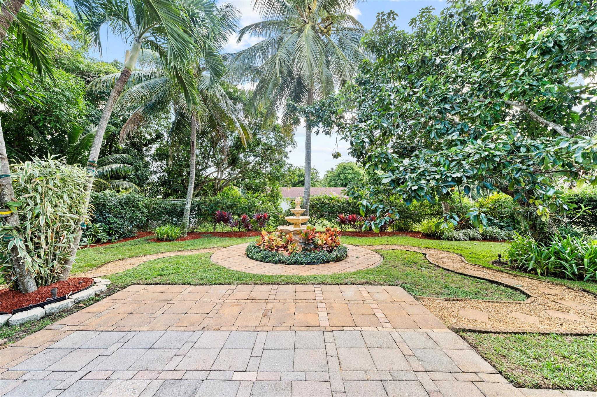 946 Alamanda Road West Palm Beach, FL 33405 - Photo 5 of 56 a big yard with plants and large trees
