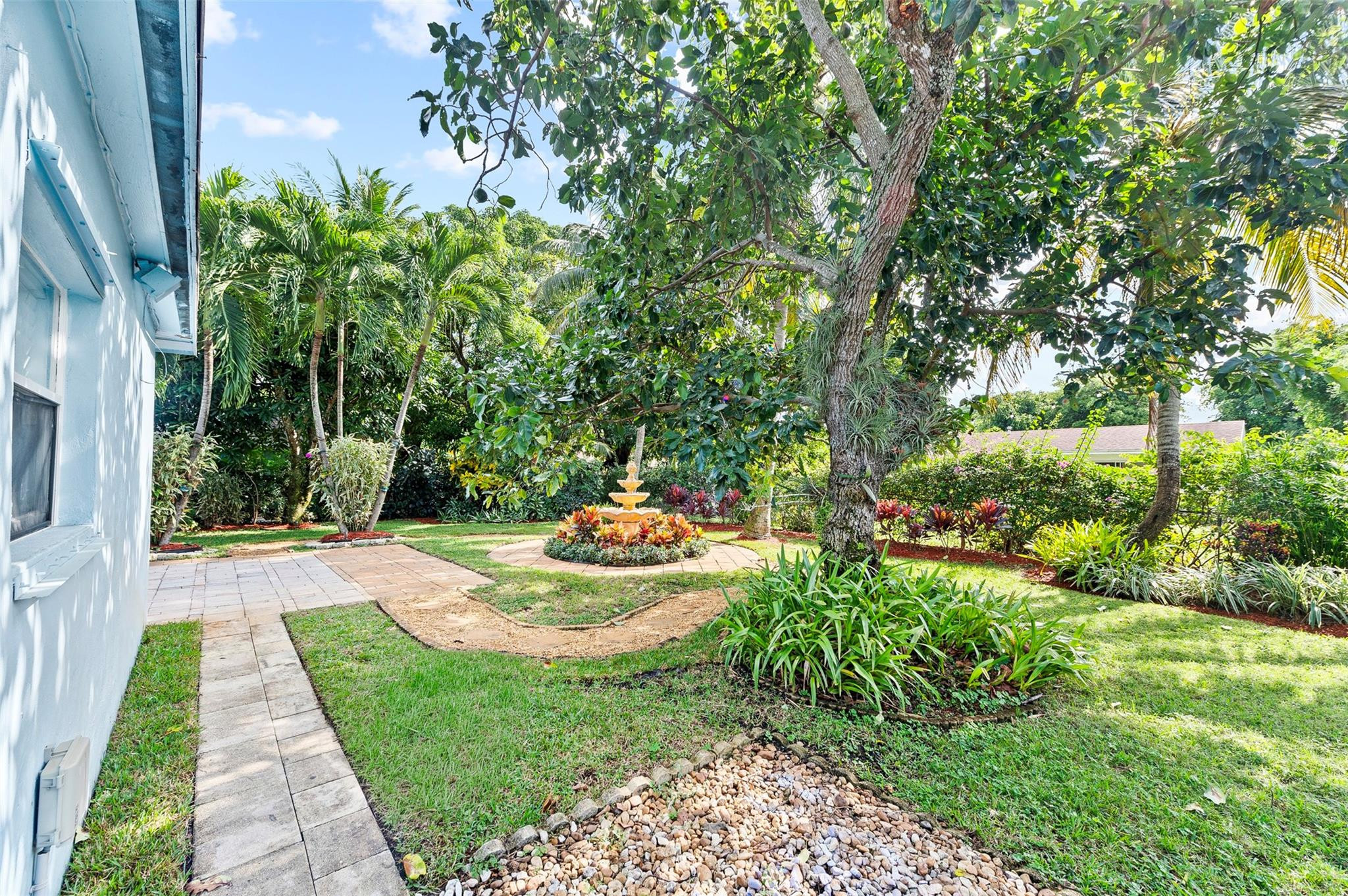 946 Alamanda Road West Palm Beach, FL 33405 - Photo 54 of 56 a view of a backyard with sitting area
