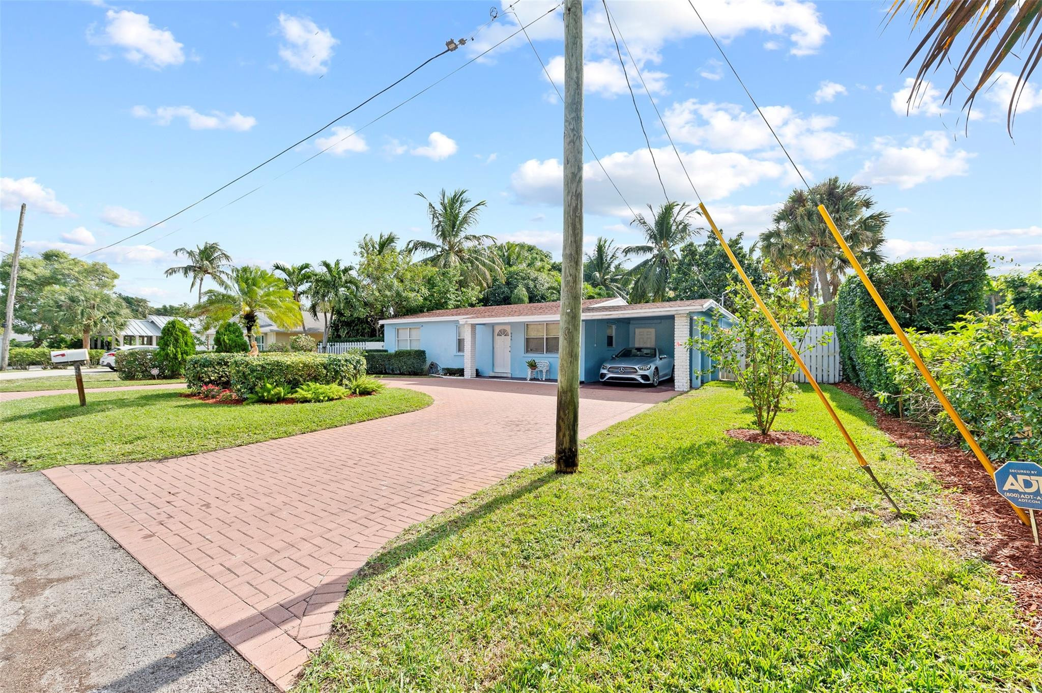 946 Alamanda Road West Palm Beach, FL 33405 - Photo 55 of 56 a view of a house with a big yard and potted plants