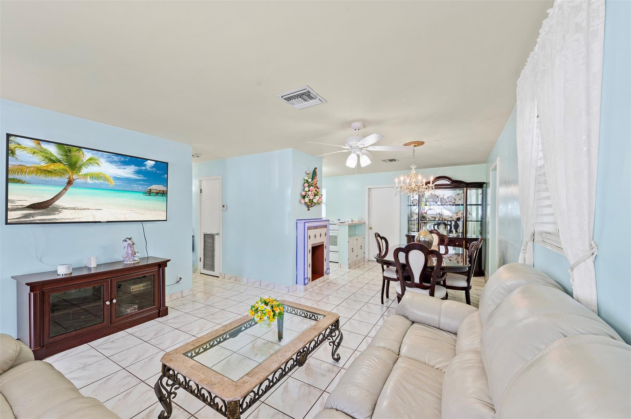 946 Alamanda Road West Palm Beach, FL 33405 - Photo 7 of 56 a living room with furniture and a flat screen tv