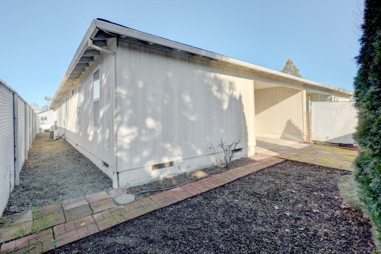 417 Crystal Drive Eagle Point, OR 97524 - Photo 29 of 35 a backyard of a house with a yard and outdoor seating