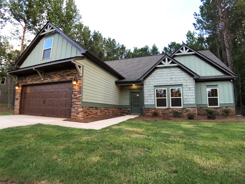 330 Walnut Grove Road Gray, GA 31032 - Photo 2 of 42 a front view of a house with a yard and garage