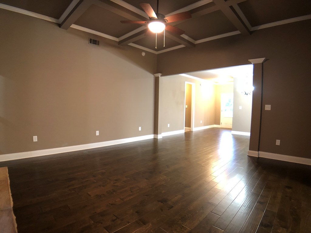 330 Walnut Grove Road Gray, GA 31032 - Photo 16 of 42 a view of an empty room with wooden floor and a window
