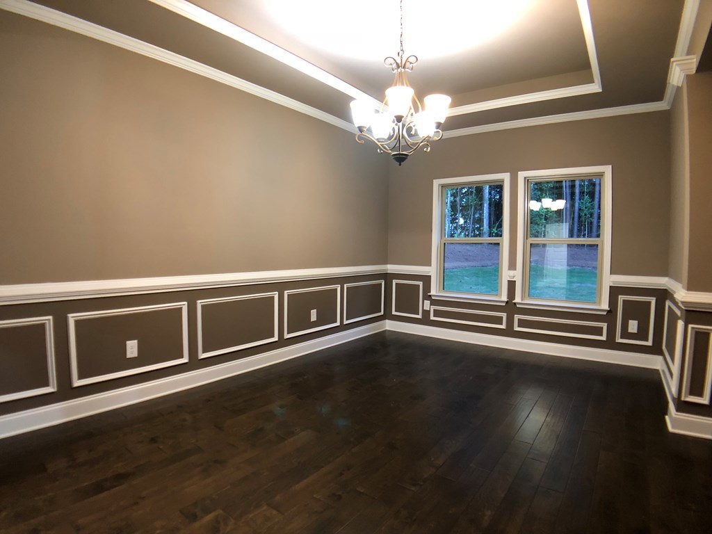 330 Walnut Grove Road Gray, GA 31032 - Photo 17 of 42 a view of a livingroom with wooden floor and chandelier