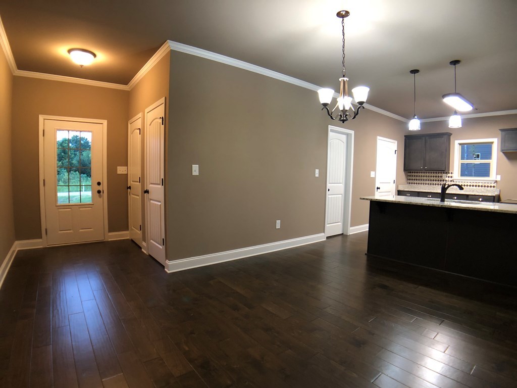330 Walnut Grove Road Gray, GA 31032 - Photo 22 of 42 a view of a room with wooden floor and kitchen view